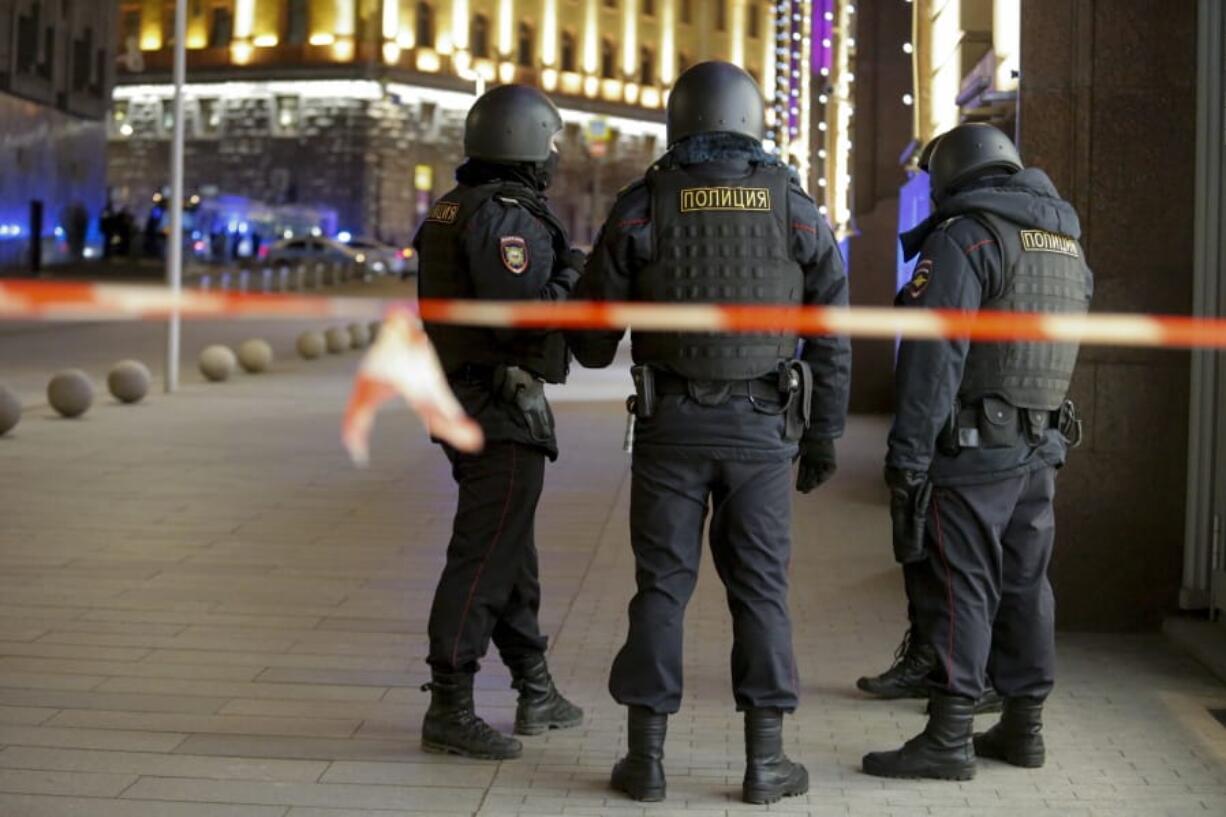 Russian police officers secure the area near the building of the Federal Security Service (FSB, Soviet KGB successor) in the background in Moscow, Russia, Thursday, Dec. 19, 2019. Russian officials say an officer of Russia&#039;s main security agency has been killed by an unidentified gunman near its Moscow headquarters and five others have been injured.