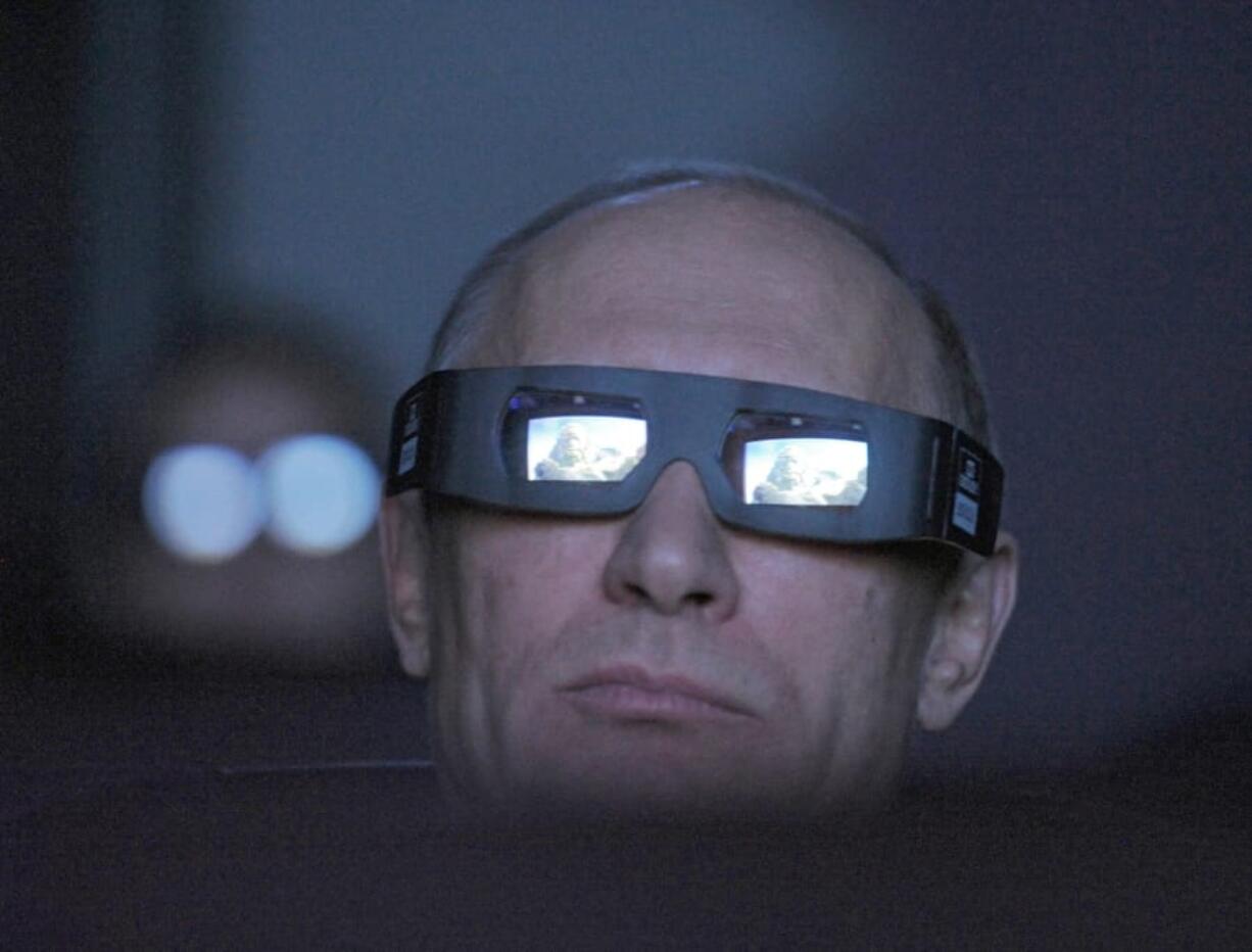 FILE In this file photo taken on Thursday, April 12, 2012, Russian Prime Minister Vladimir Putin wears 3D glasses as he visits Moscow&#039;s Planetarium in Moscow, Russia. Russian President Vladimir Putin prepares to mark his 20th year in power, as the longest-serving leader since Joseph Stalin.