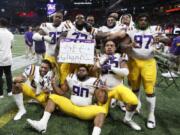 LSU players celebrate after the Southeastern Conference championship NCAA college football game against Georgia, Saturday, Dec. 7, 2019, in Atlanta. LSU won 37-10.