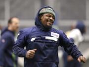 Seattle Seahawks running back Marshawn Lynch runs through warmups at the NFL football team&#039;s practice facility Tuesday, Dec. 24, 2019, in Renton, Wash. When Lynch played his last game for the Seahawks in 2016, the idea of him ever wearing a Seahawks uniform again seemed preposterous. Yet, here are the Seahawks getting ready to have Lynch potentially play a major role on Sunday against San Francisco with the NFC West title on the line.