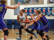 Skyview's Kazz Parks drives through the Columbia River defense.