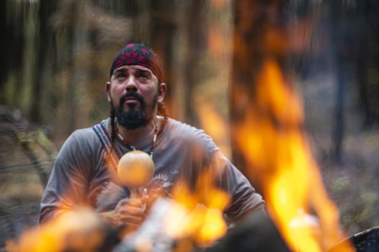 In a private moment, Bolivar prays to the spirit of his ancestors ahead of a sweat lodge ceremony in Bloomingburg, N.Y., on Oct. 27.