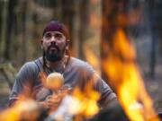 In a private moment, Bolivar prays to the spirit of his ancestors ahead of a sweat lodge ceremony in Bloomingburg, N.Y., on Oct. 27.