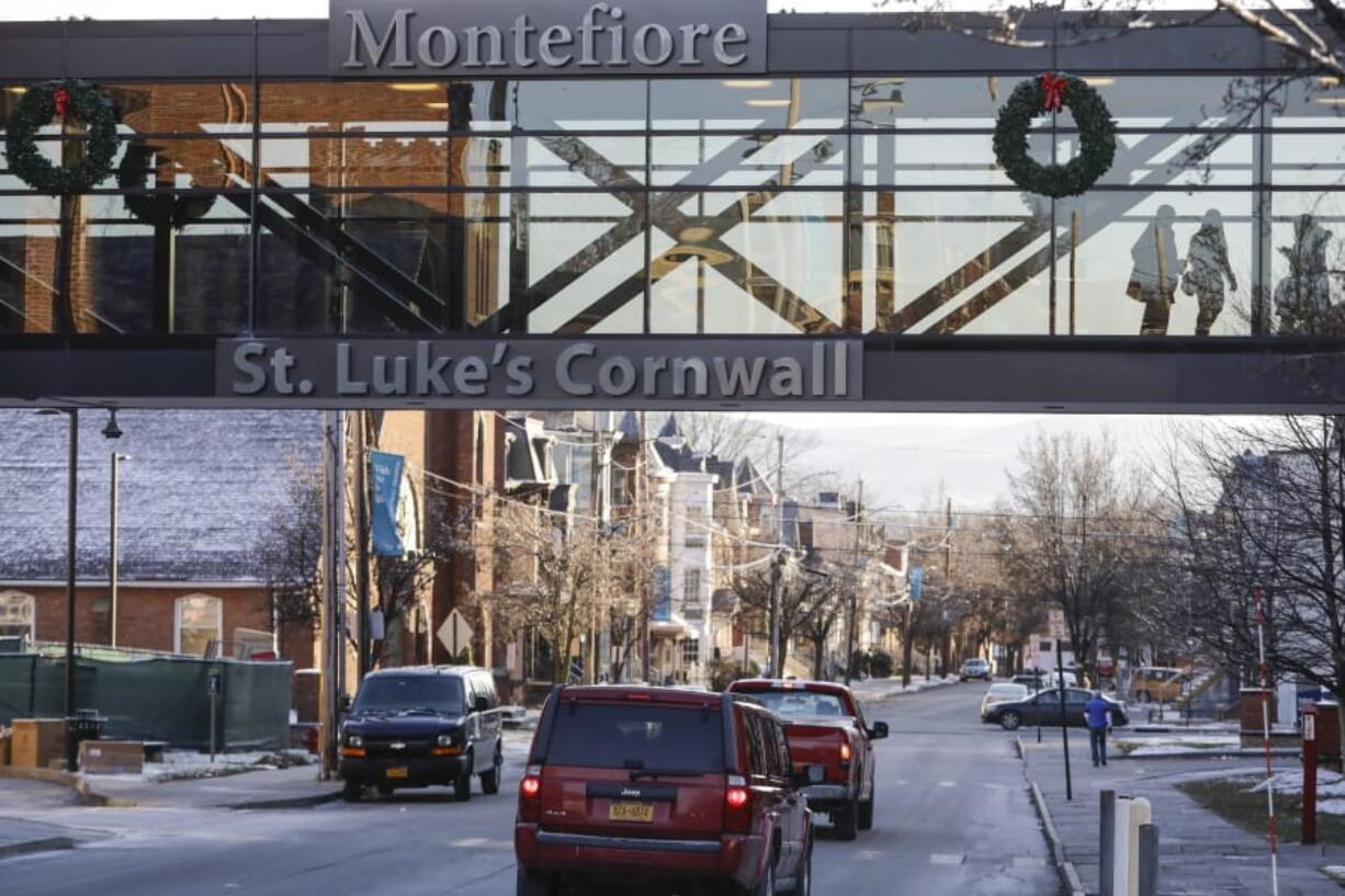 In this Thursday, Dec. 19, 2019 photo, pedestrians pass at St. Luke&#039;s Cornwall Hospital in Newburgh, N.Y. The hospital adopted the Hudson Valley Interlink Analytic System earlier this year, which tracks drug overdoses in New York. The system is among a number of surveillance systems being adopted around the country by police, government agencies and community groups.