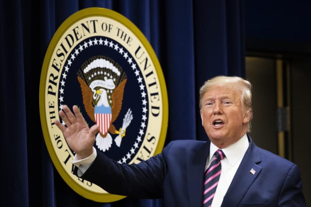 President Donald Trump waves during a summit on transforming mental health treatment to combat homelessness, violence, and substance abuse, at the he Eisenhower Executive Office Building on the White House complex in Washington, Thursday, Dec. 19, 2019, in Washington.