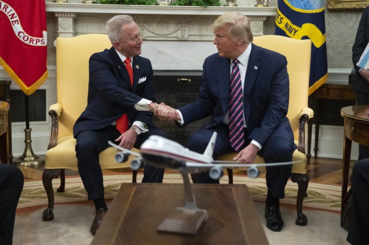 President Donald Trump meets with Rep. Jeff Van Drew, D-N.J., who is planning to switch his party affiliation, in the Oval Office of the White House, Thursday, Dec. 19, 2019, in Washington.