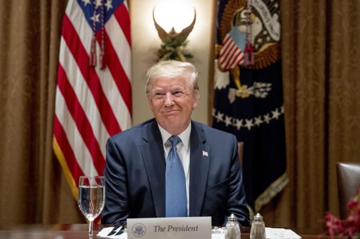 President Donald Trump smiles during a luncheon with members of the United Nations Security Council in the Cabinet Room at the White House in Washington, Thursday, Dec. 5, 2019.