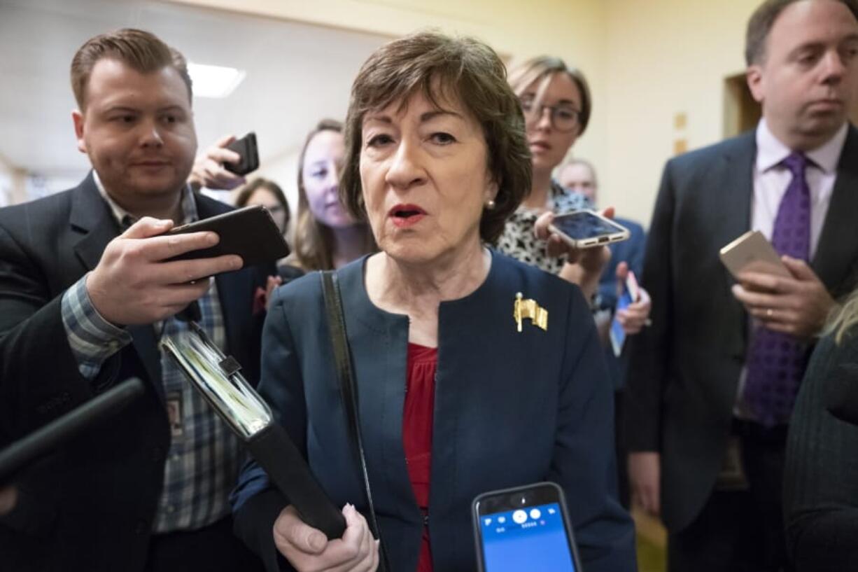 FILE - In this Nov. 6, 2019, file photo, Sen. Susan Collins, R-Maine, is surrounded by reporters as she heads to vote at the Capitol in Washington. U.S. Sen. Collins officially launched her bid for a reelection Wednesday, Dec. 18, setting up an expensive and closely watched battle for the seat the moderate Republican from Maine has held for nearly 24 years.  (AP Photo/J.