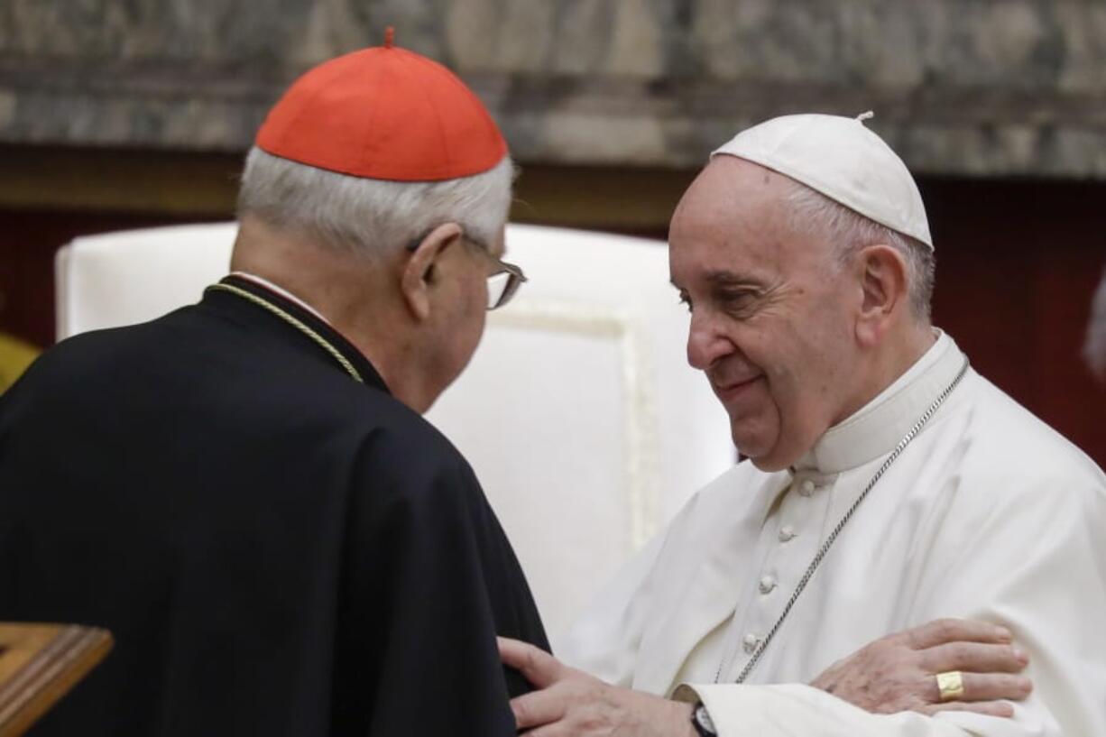 Pope Francis exchanges greetings with Cardinal Angelo Sodano, left, on the occasion of the pontiff&#039;s Christmas greetings to the Roman Curia, in the Clementine Hall at the Vatican, Saturday, Dec. 21, 2019.