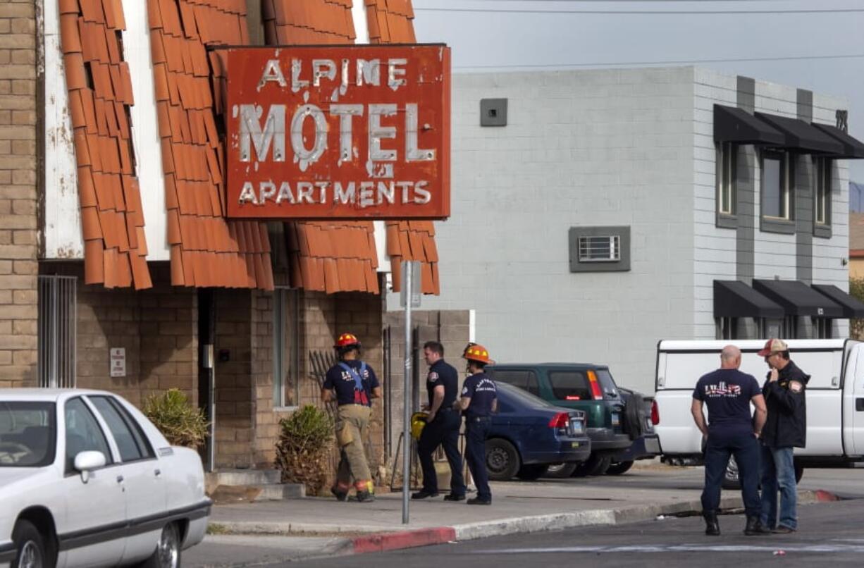 Las Vegas firefighters work the scene of a fire at a three-story apartment complex early Saturday, Dec. 21, 2019 in Las Vegas.  The fire was in first-floor unit of the Alpine Motel Apartments and its cause was under investigation, the department said.  Authorities say multiple fatalities were reported and several were injured.