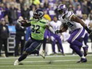 Seattle Seahawks&#039; Chris Carson runs on a 26-yard carry as Minnesota Vikings&#039; Danielle Hunter pursues during the second half of an NFL football game, Monday, Dec. 2, 2019, in Seattle. (AP Photo/Ted S.