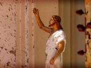 FILE - In this April 21, 2019, file photo, bloodstains a Jesus Christ statue at the St. Sebastian&#039;s Church after a blast in Negombo, north of Colombo, Sri Lanka. On Easter Sunday, April 21, bombs shattered the celebratory services at two Catholic churches and a Protestant church in Sri Lanka.