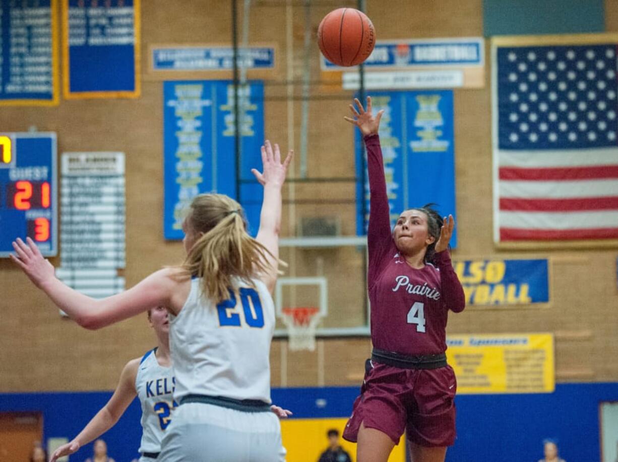 Prairie guard Alli Corral makes a running floater over Kelso&#039;s Evermore Kaiser. Corral had eight points.