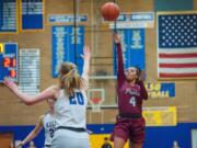 Prairie guard Alli Corral makes a running floater over Kelso&#039;s Evermore Kaiser. Corral had eight points.