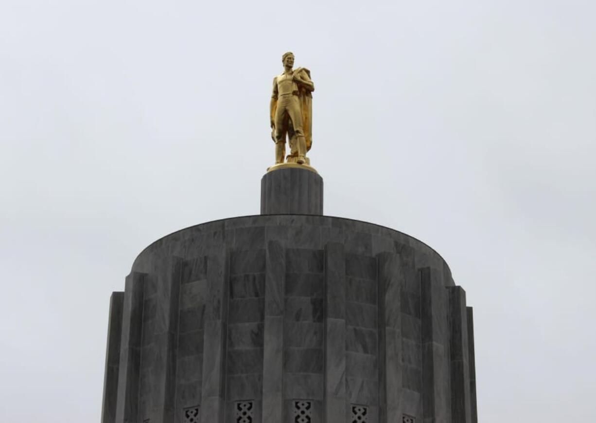 Oregon Pioneer, also known as Gold Man, is an eight-and-a-half ton bronze sculpture with gold leaf finish that sits atop the Oregon State Capitol in Salem, Ore.