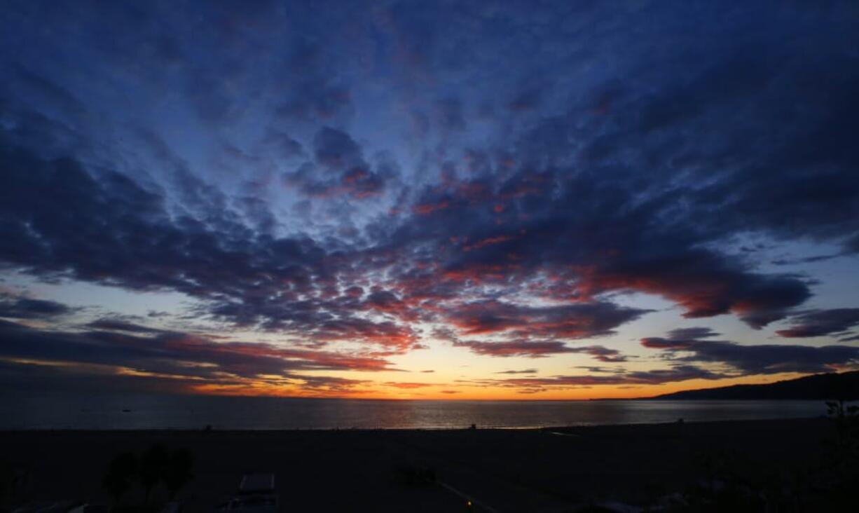 The sun sets over the Pacific Ocean on Dec. 30 in Santa Monica, Calif.