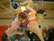 Heritage&#039;s Israel Gonzalez throws Ridgefield&#039;s Bracen Nash at the 2019 Clark County Wrestling Championship at Battle Ground High School.