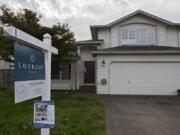 A sign notifies those passing by of a home for sale in Salmon Creek in October.