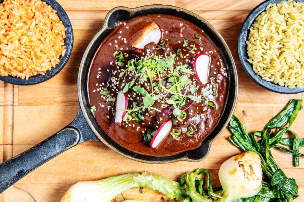 Garnish this mole with sesame seeds, fresh radishes and greens and serve with rice.