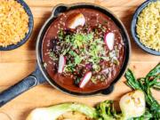 Garnish this mole with sesame seeds, fresh radishes and greens and serve with rice.