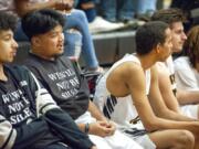 Hudson&#039;s Bay basketball player Darol Alafanso, center, wears a T-shirt reading &quot;We Will Not Be Silent&quot; on Friday against Kelso. Players and fans demonstrated against racial taunts they say they experienced during a game Jan. 7 in Kelso.