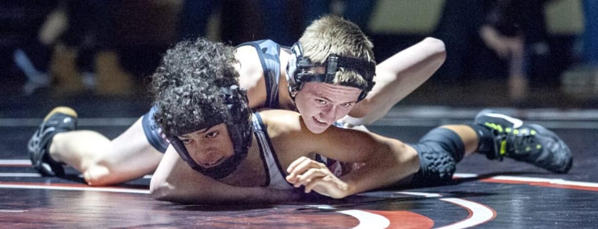 Union&#039;s Ricky Pierce (106) won by first-round pin over Camas&#039; Chase Reid in a 4A Greater St. Helens League dual on Wednesday in Camas. The Titans won 54-19.