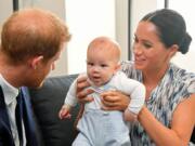 The Duke and Duchess of Sussex holding their son Archie during a meeting Sept. 25 with Archbishop Desmond Tutu and Mrs. Tutu at their legacy foundation in Cape Town, on day three of their tour of Africa.