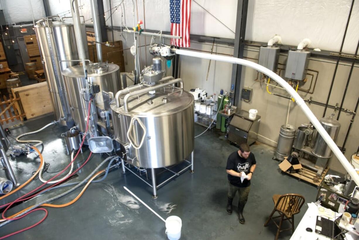 Brewer John Bitter walks through 54-40 Brewing of Washougal in 2018.