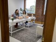 Callie Christensen, left, and Kelly Oriard, co-founders and CEOs of Slumberkins, pause for a photo Sept. 11 in their downtown Vancouver office. The company recently announced it has raised $2.8 million in a seed funding round.