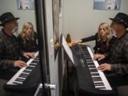 Tommy Neal, 72, takes a piano lesson with Rachel Risor at Music World in Hazel Dell. “This is the best thing I’ve ever done — not just playing randomly but learning each time,” he said.