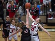 Union's Sarah Litchford (33) and Camas' Faith Bergstrom (22) tipoff at the start of Tuesday night's game at Camas High School in Camas on Jan. 7, 2020. Camas won 52-44.