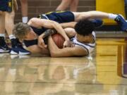 Kelso&#039;s Rees Hall (4) and Prairie&#039;s Mark Frazier (11) fight for the ball during Friday night&#039;s game at Prairie High School in Vancouver on Jan. 10, 2020. Prairie won 44-32.