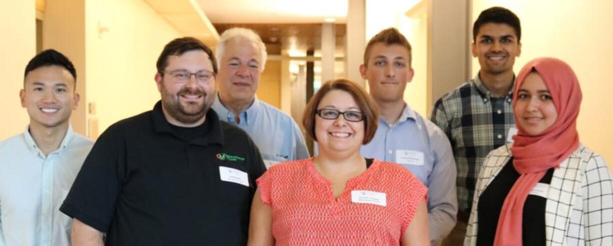 JD Rossetti, owner of Minuteman Press, second from left, is pictured with four WSU Vancouver business students who recently collaborated with the local print shop to help the business grow: Vincent Tsan, Travis Mollenkopf, Jason Gill and Alaa Elolaimi were part of the Business Growth Mentor and Analysis Program in the Carson College of Business.