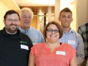 JD Rossetti, owner of Minuteman Press, second from left, is pictured with four WSU Vancouver business students who recently collaborated with the local print shop to help the business grow: Vincent Tsan, Travis Mollenkopf, Jason Gill and Alaa Elolaimi were part of the Business Growth Mentor and Analysis Program in the Carson College of Business.