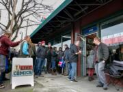 People line the block, waiting their turn to get inside I Like Comics in Vancouver for the Image Comics partner comic-book signing event. Image Comics is based in Portland, and is the third largest publisher of comic books.