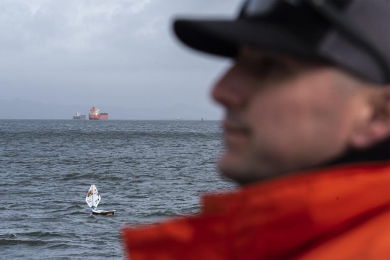 Pilot boat operator Frank Shucks watches as the mini boat S/V The Goonies sails down the Columbia River during a test launch in Astoria, Ore., on Tuesday afternoon, Jan. 21, 2020.