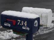 A fresh layer of snow is seen on mailboxes in the Prune Hill area of Camas on Thursday morning.