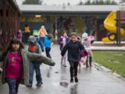 Students return to their classrooms at the conclusion of recess at Union Ridge Elementary School.