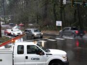 Cars pass through the intersection of Northeast Everett Street and Northeast Lake Road in Camas on Thursday at the site of a roundabout.