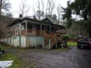 Community Roots Collaborative, a local nonprofit seeking to alleviate homelessness, works on renovations to the old Fruit Valley railway switch house in Vancouver on Monday. The building will house four tenants for $450 a month starting in March.