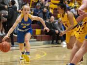 Kelso's Alexis Kleven (4) dribbles down court during Tuesday night's game at Prairie High School in Vancouver on Jan. 28, 2020.