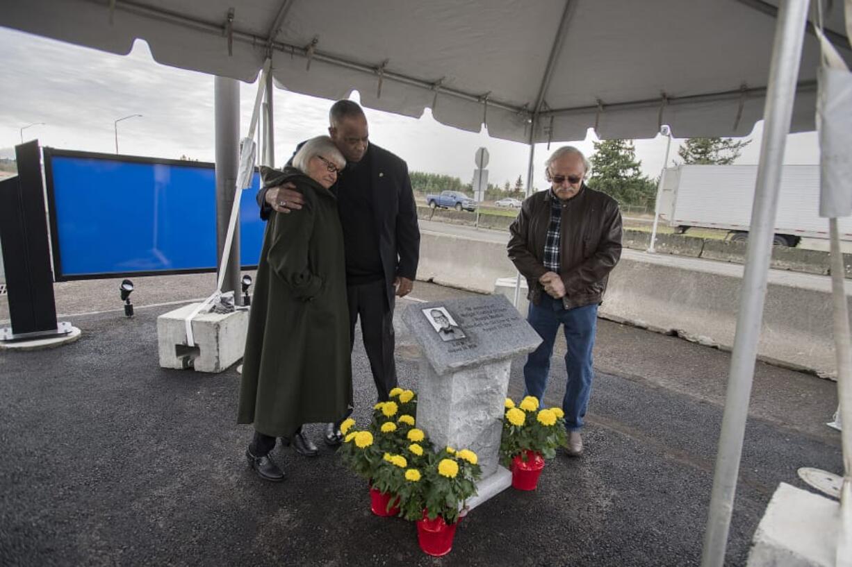 Luanne Mason, from left, daughter of the late Weight Control Officer Joseph Modlin, and Washington State Patrol Chief John Batiste join Mason&#039;s husband, Doug, after unveiling a memorial plaque in honor of Modlin at the Ridgefield Port of Entry on Thursday morning. Officer Modlin died in the line of duty Aug. 15, 1974, when he was struck by a logging truck. The Washington State Patrol Motor Carrier Safety Division also hosted a grand opening and dedication of the newly built Ridgefield Port of Entry during the event.