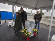 Luanne Mason, from left, daughter of the late Weight Control Officer Joseph Modlin, and Washington State Patrol Chief John Batiste join Mason&#039;s husband, Doug, after unveiling a memorial plaque in honor of Modlin at the Ridgefield Port of Entry on Thursday morning. Officer Modlin died in the line of duty Aug. 15, 1974, when he was struck by a logging truck. The Washington State Patrol Motor Carrier Safety Division also hosted a grand opening and dedication of the newly built Ridgefield Port of Entry during the event.