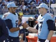 Tennessee Titans quarterbacks Marcus Mariota (8), with fellow QB Ryan Tannehill (17), was benched in mid-October, but he remains valuable to the team mimicking Tom Brady, Lamar Jackson and now Patrick Mahomes in practice for the AFC championship. He's also popped up in three straight games, completing a pass in two and going out for a pass in the last.