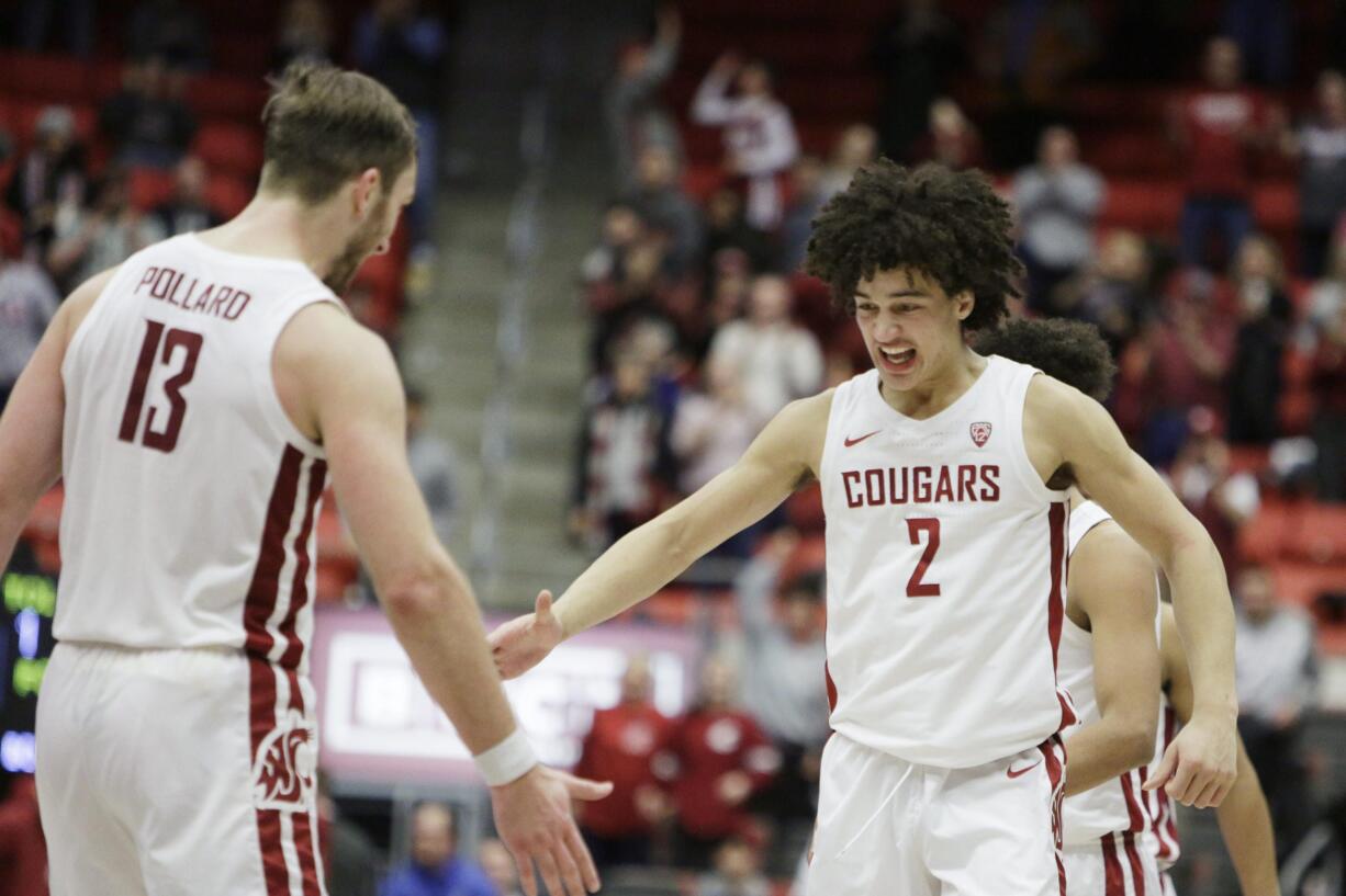 Washington State forward CJ Elleby (2) celebrates his go-ahead basket with forward Jeff Pollard (13) during the second half of the team's NCAA college basketball game against Arizona State in Pullman, Wash., Wednesday, Jan. 29, 2020.