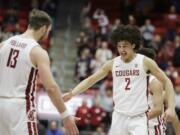 Washington State forward CJ Elleby (2) celebrates his go-ahead basket with forward Jeff Pollard (13) during the second half of the team's NCAA college basketball game against Arizona State in Pullman, Wash., Wednesday, Jan. 29, 2020.