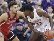 Arizona center Chase Jeter (4) pressures Washington forward Isaiah Stewart (33) during the first half of an NCAA college basketball game Thursday, Jan. 30, 2020, in Seattle. (AP Photo/Ted S.