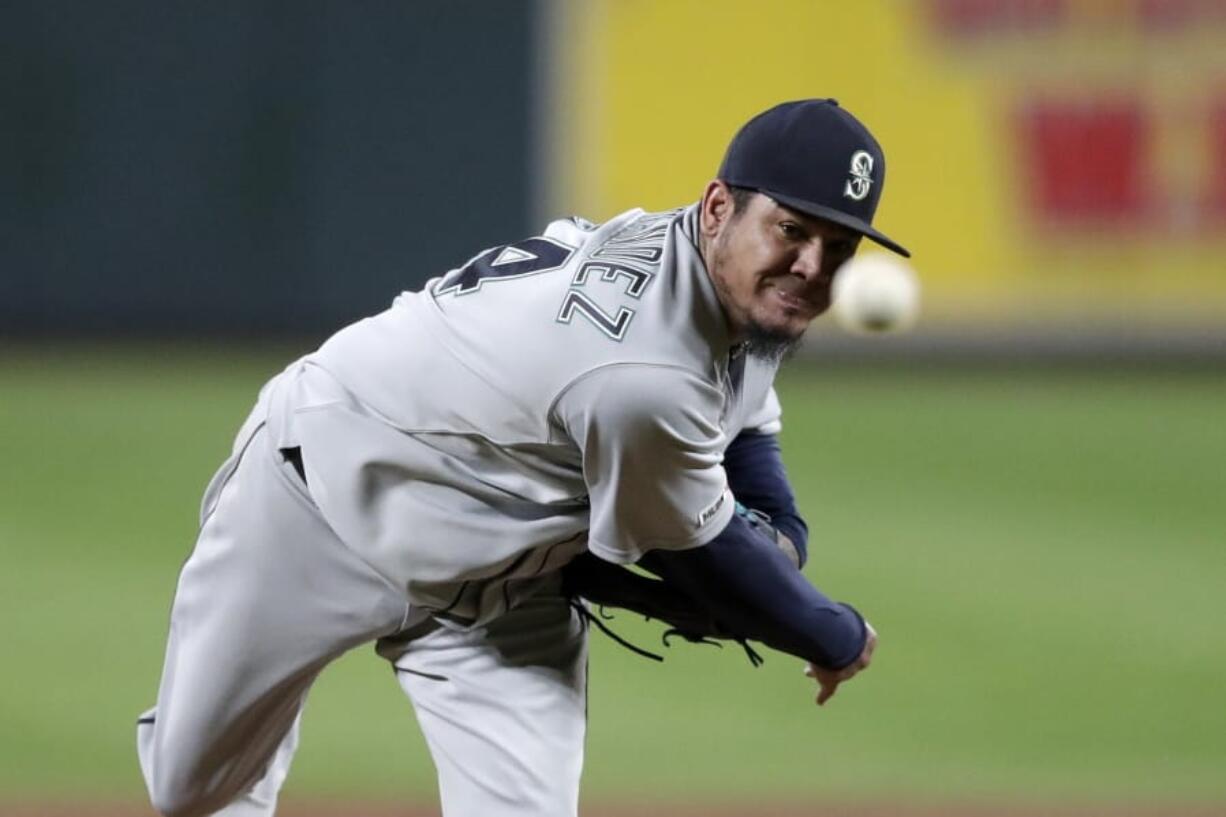 FILE - In this Sept. 20, 2019, file photo, Seattle Mariners starting pitcher Felix Hernandez throws to a Baltimore Orioles batter during the second inning of a baseball game in Baltimore. Longtime Mariners ace Hernandez reached a minor league deal with the Atlanta Braves on Monday, Jan. 20, 2020, that includes an invite to big league spring training.