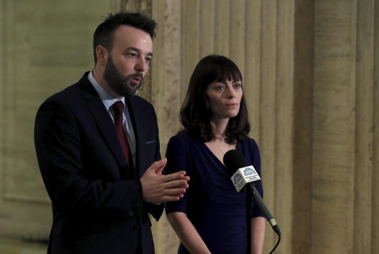 SDLP or Social Democratic and Labour Party leader Colum Eastwood, left and deputy leader Nichola Mallon speak to the media in the Great Hall of Parliament Buildings, Stormont, in Belfast, Northern Ireland, Friday, Jan. 10, 2020.