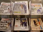 Newspapers are seen for sale in London, Thursday, Jan. 9, 2020.